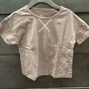 Plain brown T-shirt with white stitching detail